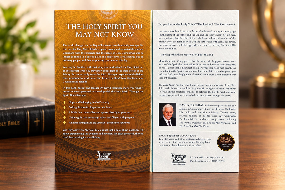 A two-page booklet or brochure spread laid flat on a white background. The left page has a large gold-toned circular map design with the title 'THE HOLY SPIRIT YOU MAY NOT KNOW' at the top and several paragraphs of text below.